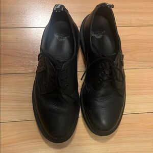 Dr. Martens Black Oxfords with Smooth Leather Upper and Lace-Up Closure
